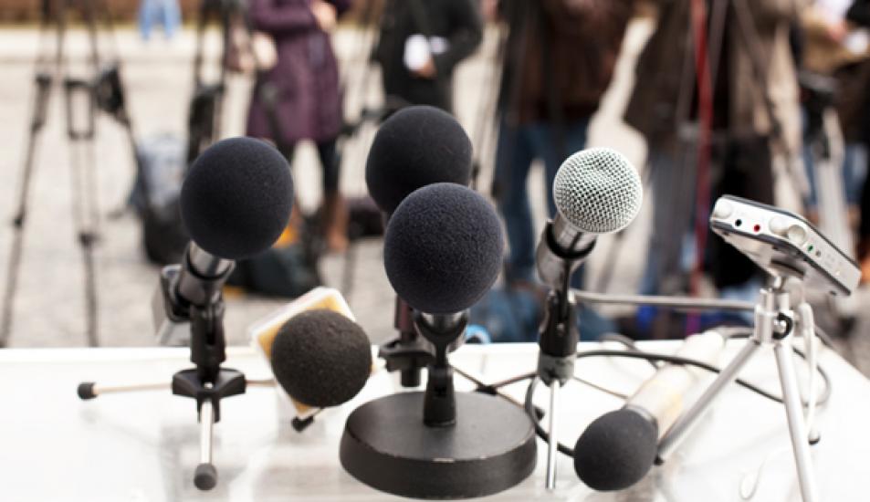 Microphones at a news conference