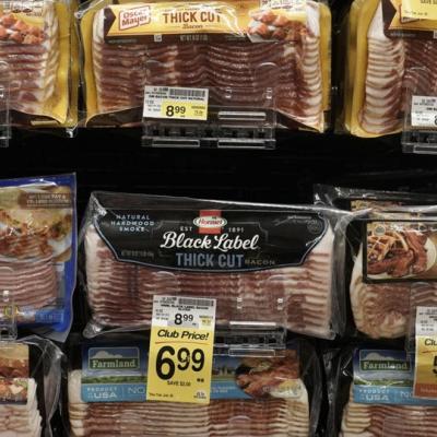 Pack of Bacon on the Shelf with price tag of $6.99