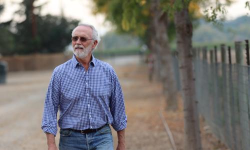 Congressman Dan Newhouse Walking on Farm